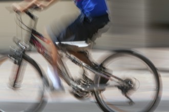 Man riding a bicycle, Photo with motion blur, City of Quito, Pichincha province, Ecuador, South