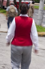 Woman walking in street, Photo with motion blur, City of Quito, Pichincha province, Ecuador, South