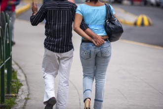 Couple walking in street, Hand in hand, City of Quito, Pichincha province, Ecuador, South America