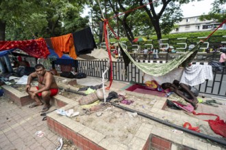 Devotees staying in street divider as they arrives to visit Kamakhya Temple during Ambubachi Mela,