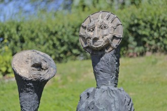 Sculpture Sun and Moon by Markus Lüpertz 2017, modern art, bronze sculpture, two faces, moon face,