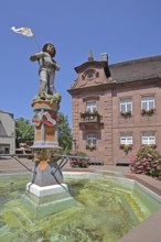 Sculpture of St George with lance, St George's fountain, dragon slayer, water basin, town coat of