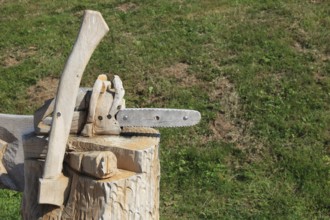 Chainsaw and axe carved from wood as decoration