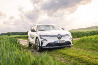 A white Renault vehicle parked on a dirt track under a cloudy sky, Deer E- CarSharing, Renault
