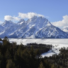 View over the Snake River... Teton Range (Rocky Mountains) in winter with snow, down in the valley