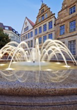 Old market with fountain and town houses in the evening, Bielefeld, East Westphalia-Lippe, North
