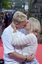 Jens Knossi Knossalla with girlfriend Lia Mitrou (influencer) at the German premiere of the