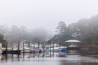 Private fishing boats in the harbor at Ocean Springs, Mississippi on a foggy morning