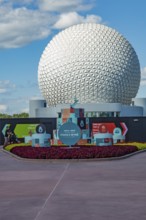 Sign in front of the Spaceship Earth geodesic sphere near entrance to the Food and Wine Festival in