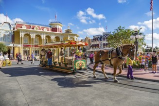 Horse pulling trolley car with Disney characters down Main Street in the Magic Kingdom at Walt