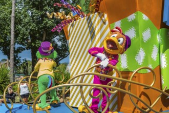 Disney character riding on float during parade through the Frontierland area of Magic Kingdom at