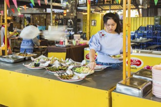 Selection of prepared foods available for customers at a buffet style outdoor restaurant in Chiang