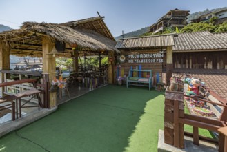 Stairs lead down to the Doi Phamee coffee shop and restaurant in Mae Sai district of Chiang Rai,