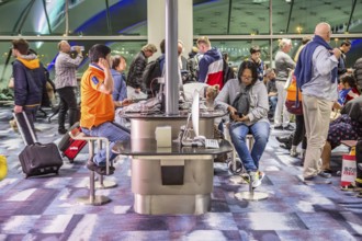 Travellers using Internet station at gate in terminal of Suvarnabhumi Airport at Bangkok, Thailand