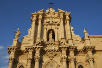 Cathedral of Syracuse, detailed view of the cathedral with sculptures and blue sky in the