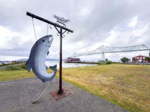 Fish sculpture in front of the Astoria Megler Bridge on the Columbia River, Astoria, Oregon, USA,