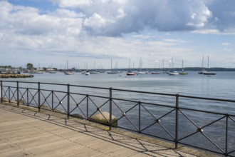 Sailboats in the harbour, promenade, dark clouds, Eckernförde, Baltic Sea, Schleswig-Holstein,