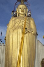 32 metre high standing Buddha decorated with glass mosaics and 24 carat gold, the upper knot of the