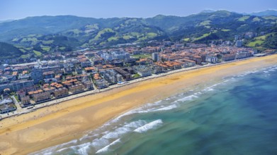 Aerial view of zarautz, gipuzkoa, showcasing the golden sands meeting the turquoise waves of the