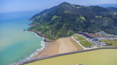 Aerial perspective captures the stunning coastal beauty of orio, spain, showcasing the beach,