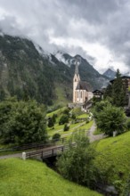 Parish church of St Vincent in Heiligenblut, cloudy mountain landscape, courtyard, Heiligenblut am
