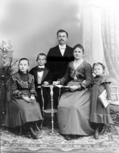 Father Mother Boy Girl, 1920s, A formal family portrait with parents and three children in