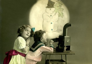 Children's slide projector snowman, 1912, Two children watching a snowman projection, nostalgic
