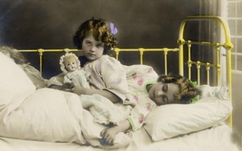 2 girls bed doll, 1920s, Two girls in a bed, one holding a doll, nostalgic and peaceful atmosphere,