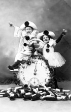 12 o'clock New Year's Eve Prosit, 1920s, Two children dressed as clowns, sitting on a large clock,