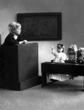 Doll school 1910, A child gives lessons for dolls in a miniature classroom, Historical photo