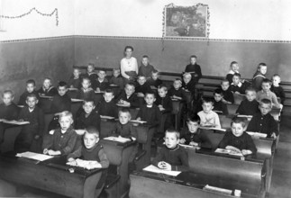 School class, all boys, 1920s, pupils in a classroom sitting attentively and listening to a