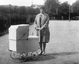 Woman with pram, 1930s, Woman with pram in a park, historical black and white photo with vintage