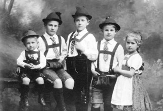 Five children in traditional costumes, 1930s, Five children in traditional costumes pose together