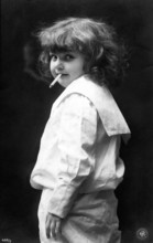 Girl smoking a cigarette, 1920, A child with a cigarette in her mouth, in a striking and