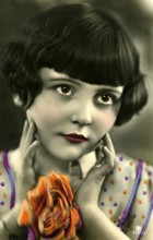 Kitschy portrait of a girl, 1920, Portrait of a girl with flowers in vivid colours, friendly smile,
