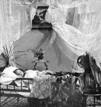 Guardian angel angel, 1910s, A child sleeps in bed while a ghostly veil hovers over him, Historical