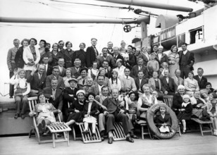 Group on ship deck, 1920s, Large group of people posing on a ship for a joint photo, Historical