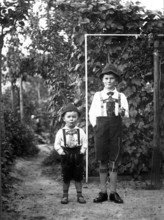 Big and little boy, 1920, Two boys in traditional traditional costume proudly posing in their