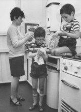 Mother and sons drying dishes, Housework, Education, 1960s, A mother and two children drying dishes
