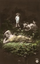 Woman and children posing in the forest, 1910s, Two woman and a child in a flowery meadow with a