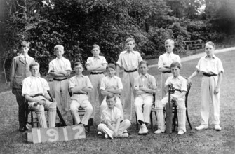 Cricket team, 1920s, Young cricket team members in uniform posing as a team outdoors, historical