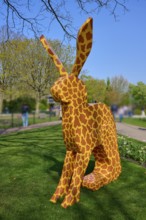 Bunny sculpture with pattern in a park under a blue sky, Keukenhof, Lisse, province of South