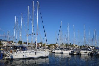 A harbour full of sailing boats and yachts against a clear blue sky, Marina, Kos Town, Kos,