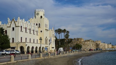 Waterfront promenade with historic building and sea view on a cloudy day, Governor's Palace, Kos
