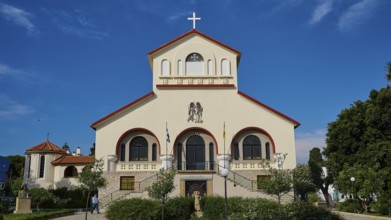 Frontal view of a church with a cross in front of a blue sky, Kos Cathedral, Kos Town, Kos,