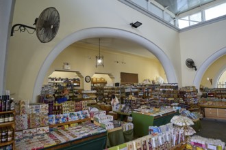 Bright market interior with shelves full of products and large arches, market hall, Agora, Kos
