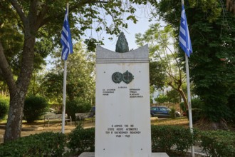 Monument in a park-like setting with flags and surrounded by lush trees, Memorial, Wars 1940-1945,