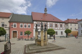 Baroque town hall built in 1699 and fountain with sculptures by Christof Traub 1995, symbols for