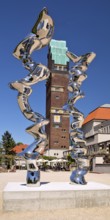 Stainless steel sculpture entitled Points of View by Tony Cragg in front of the Wedding Tower,