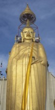 32 metre high standing Buddha decorated with glass mosaics and 24 carat gold, the upper knot of the